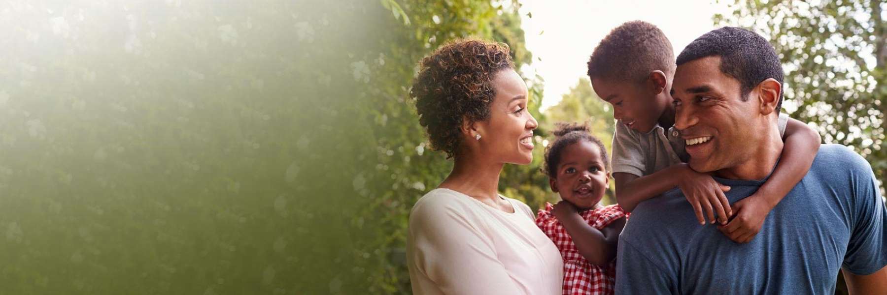mom, dad, daughter, and son smiling