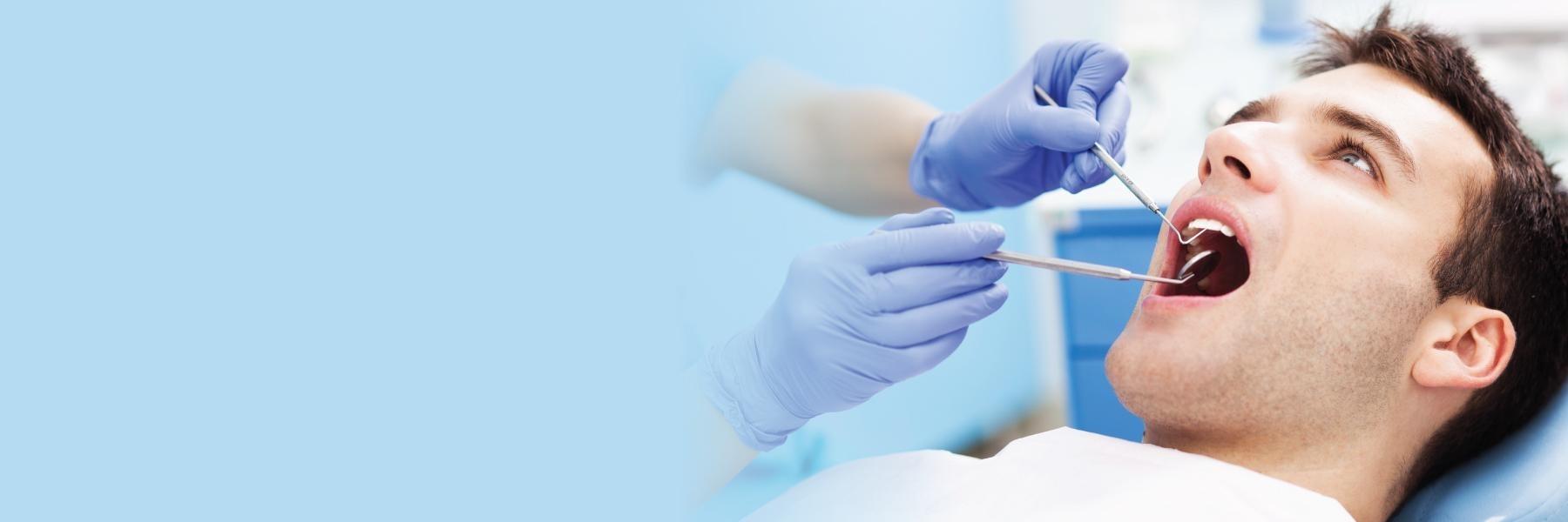 man sitting in dental chair in west covina